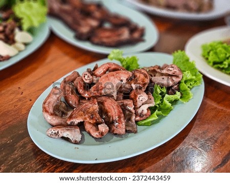 Grilled pork intestine served with spicy sauce, Northeastern region of Thailand (Jaew sauce). Isaan Food, Thai street Food. Thai local street food by home cooking chef