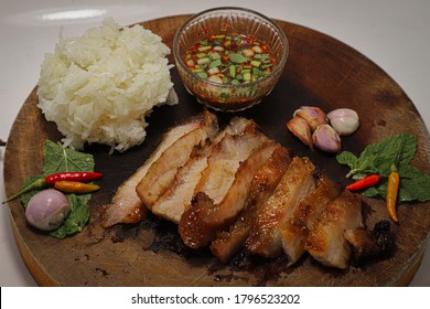 Grilled pork jowl with sticky rice and spicy Thai sauce