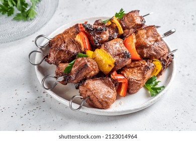 Grilled pork kebab with red and yellow pepper