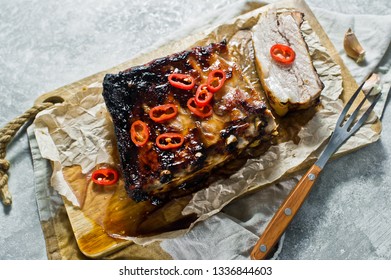 Grilled pork ribs with chili pepper. Grey background, top view - Shutterstock ID 1336844603