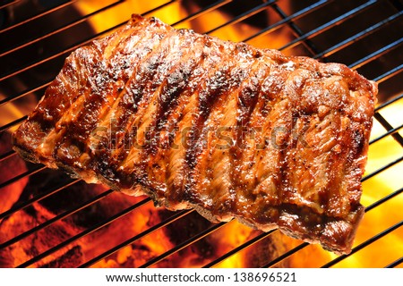 Grilled pork ribs on the grill.