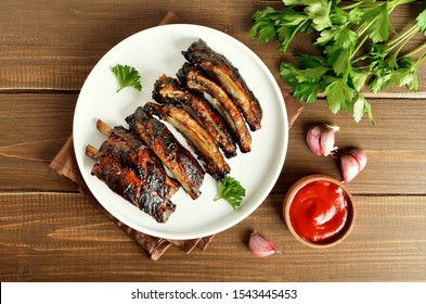 Grilled Pork Ribs On White Plate. Tasty Bbq Meat. Top View, Flat Lay