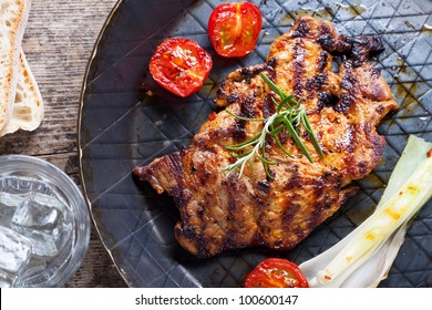 Grilled Pork Steak In An Iron Pan