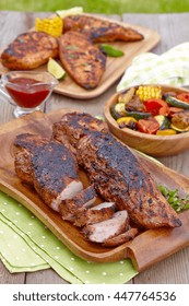 Grilled Pork Tenderloin Served On A Wooden Board