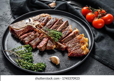 Grilled Porterhouse Steak On A Chopping Board. Cooked Beef Meat. White Wooden Background. Top View