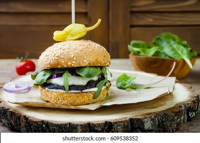 Grilled Portobello Mushroom Burger. Healthy Veggies Hamburger With Onions, Arugula, Cheese, Spicy Pickled Hot Peppers And Tartar Sauce. Copy Space Background