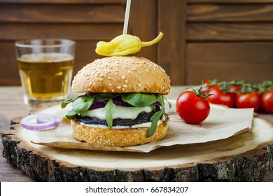 Grilled Portobello Mushroom Burger. Healthy Veggies Hamburger With Onions, Arugula, Cheese, Spicy Pickled Hot Peppers And Tartar Sauce. Copy Space Background