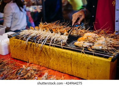 Grilled Prawns On Sale At Street Food Market In Bangkok, Thailand.