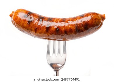 Grilled precook smoke beef sausage on a fork isolated on white background, clipping path