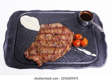 Grilled Prime Ribeye Steak With Tomato, Potato Puree And Pepper Corn Sauce