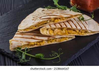 Grilled quesadillas on black wooden background - Powered by Shutterstock