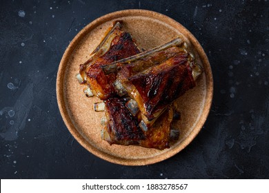  Grilled Ribs In Barbecue Sauce On The Plate Top View