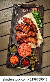 Grilled Ribs With Flatbread And Sauces