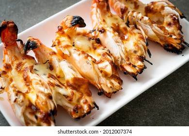 grilled river prawns or shrimps with cheese - seafood style