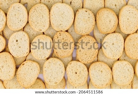 Grilled round bread  with extra virgin olive oil and rosemary. It is the base to prepare small  Bruschetta, well-known italian antipasto.