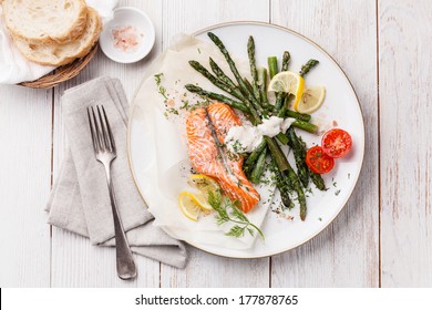 Grilled Salmon With Asparagus On White Wooden Background