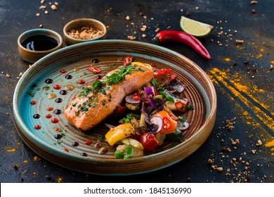 Grilled Salmon with cooked Vegetables, Keto friendly salmon with vegetables diet dish. Paleo, keto, fodmap, dash diet. Healthy concept, gluten free, lectine free