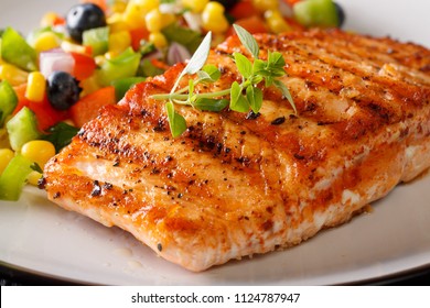 Grilled Salmon Fillet With Salsa Of Corn, Blueberries And Pepper Macro On A Plate. Horizontal
