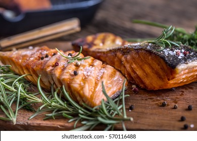 Grilled Salmon Fillets With Salt Pepper And Herb Decoration.