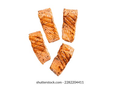 Grilled salmon fillets steaks with salt pepper and herb on grill. Isolated on white background