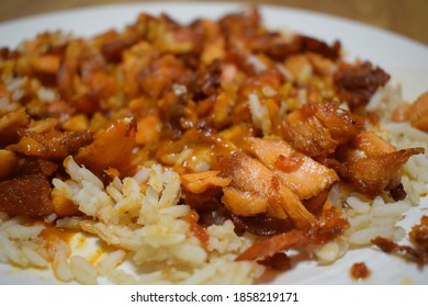 Grilled Salmon Fish, Brown Rice And Tikka Masala Sauce Dinner Food Flavor Seasoning On White Plate 