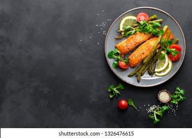 Grilled Salmon Fish Steak, Asparagus, Tomato And Corn Salad On Plate. Healthy Dish For Lunch. Top View