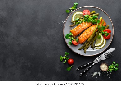 Grilled Salmon Fish Steak, Asparagus, Tomato And Corn Salad On Plate. Healthy Dish For Lunch. Top View