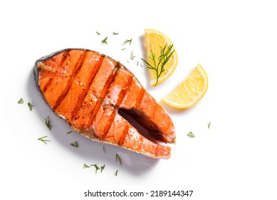 Grilled salmon fish steak isolated on white background. Roasted salmon piece - healthy food ingredient. - Shutterstock ID 2189144347