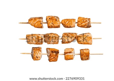 Grilled salmon kebab skewers. Isolated on white background.