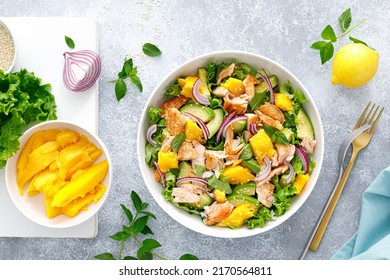 Grilled Salmon And Mango Salad With Avocado And Fresh Green Lettuce