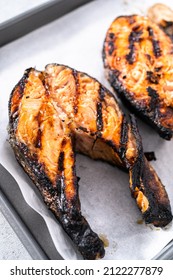 Grilled Salmon Steaks On A Baking Sheet With Parchment Paper.