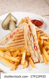 Grilled sandwiches with chicken and egg served with french fries