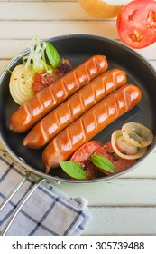 Grilled sausage with on hot barbecue dish