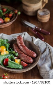 grilled sausages with salad and vegetables