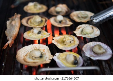 Grilled Scallops And Sea Shrimp With Butter On Grill Pan. Seafood Barbecue Or Bbq For Family Party At Night