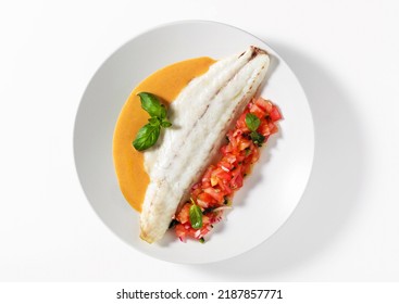 Grilled Sea Bass Fillet With Tomato Basil  Salad And Gravy On White