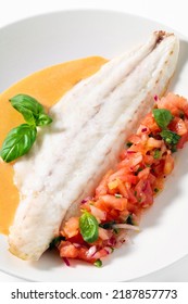 Grilled Sea Bass Fillet With Tomato Basil  Salad And Gravy On White