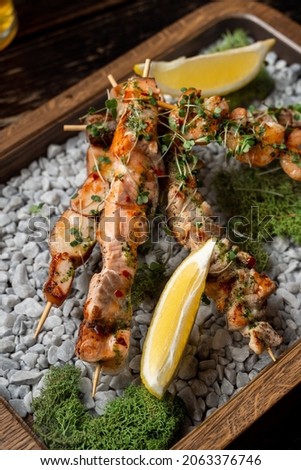 Similar – Image, Stock Photo Skewering moss on a wall stone in front of a blurred background