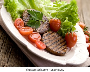 Grilled Seitan With Tomatoes And Salad