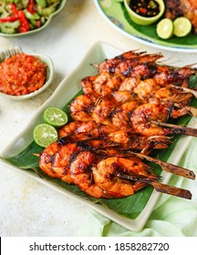 Grilled Shrimp With Honey Garlic Sauce On The Skewers, Served With A Squeeze Of Lime And Chili Sauce. 