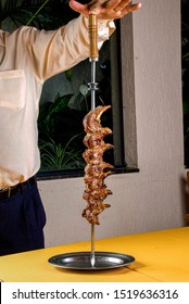 Grilled Skewered Goat Meat On A Brazilian Steakhouse Table