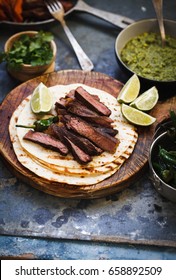 Grilled Skirt Steak Fajitas Recipe. Beef Steak Fajitas Tacos Hot Tortillas With Avocado Salsa, Herbs, Lime, Pepper Sliced.