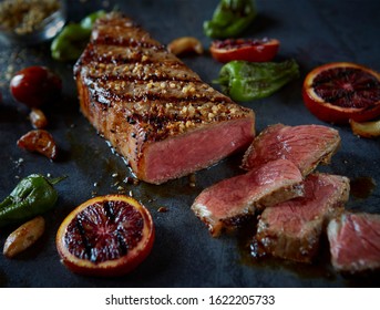 Grilled And Sliced KC Strip Steak With Grilled Citrus And Peppers