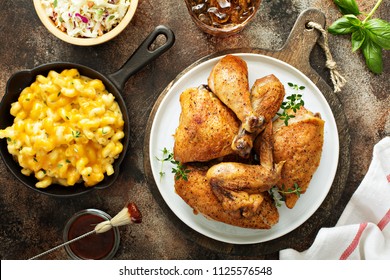 Grilled Or Smoked Chicken Carved Into Pieces With Mac And Cheese And Cole Slaw Overhead View