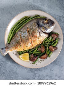 Grilled Spicy Fish Served With Asparagus And Green Beans.Colorful Food Art Composition On Plate. Top View.