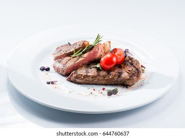 Grilled Steak Delicious Beef Meat On A White Plate On A Light Background Menu