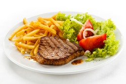 Grilled Steak, French Fries And Vegetables