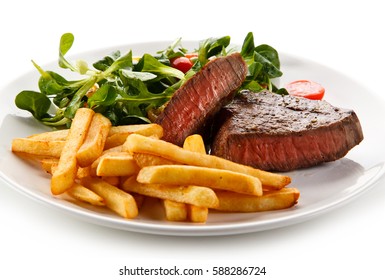 Grilled steak, French fries and vegetables  - Powered by Shutterstock