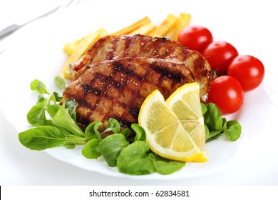 Grilled Steak Meat On A White Plate On White Isolated Background