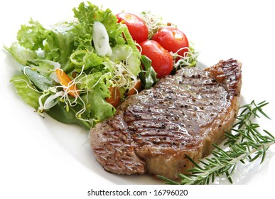 Grilled Steak With Salad.  Porterhouse Or New York Strip Steak, Grilled, With Rosemary.